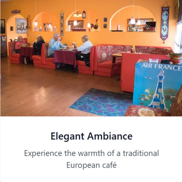 Diners seated in red booths within a European-themed cafe with orange walls and decorative arches.